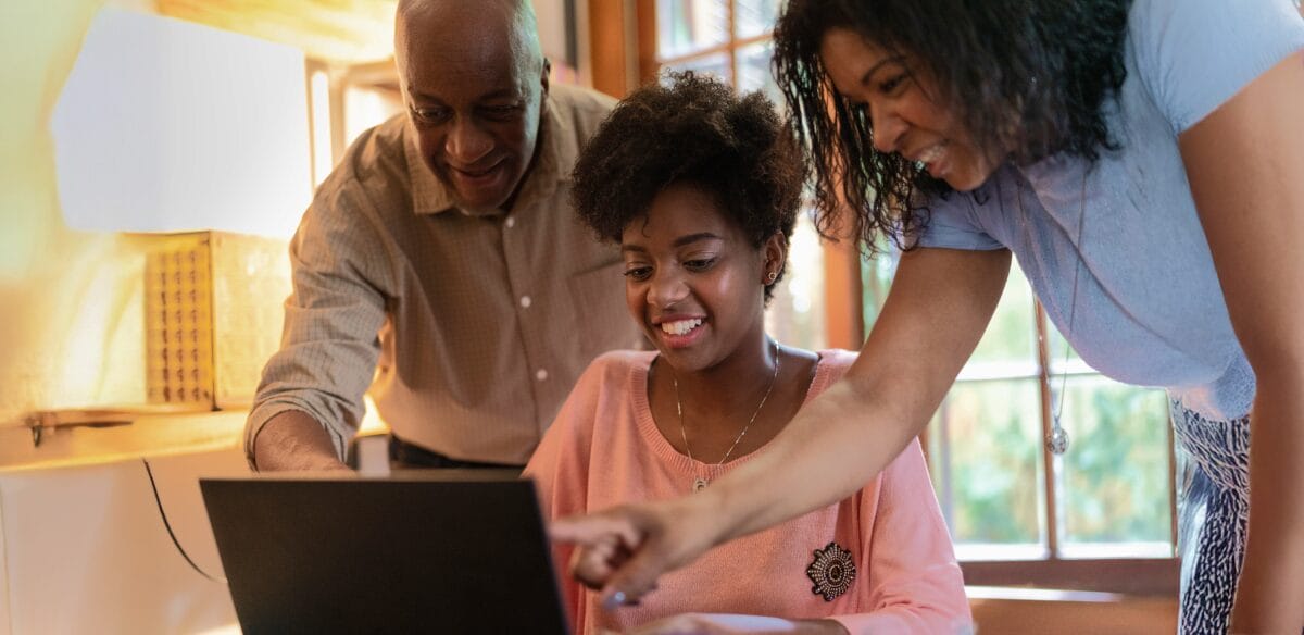 family looking the computer