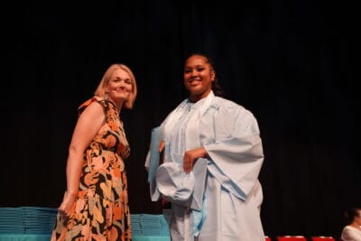 director and student smiling