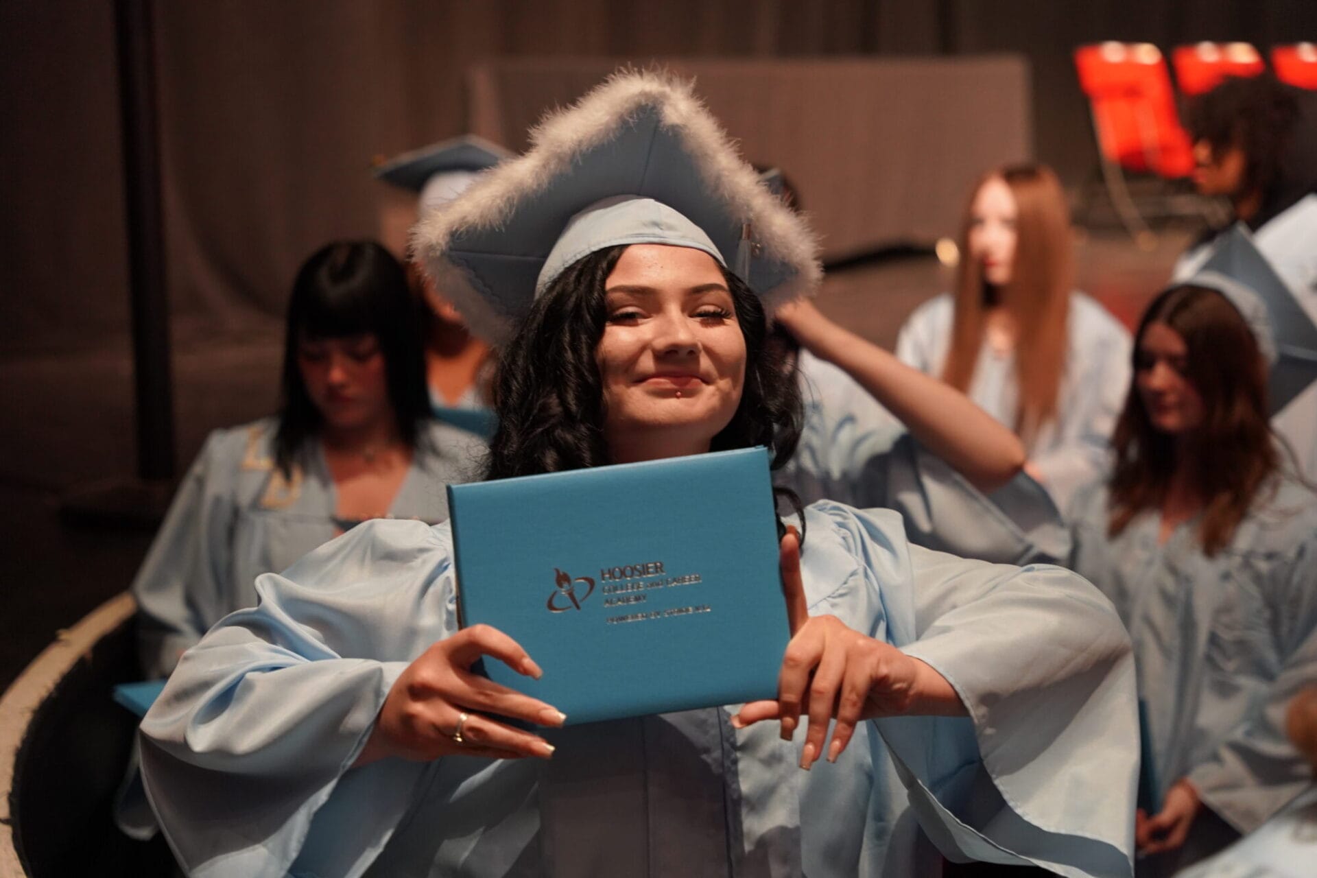 happy girl showing her diploma