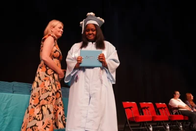 student with diploma