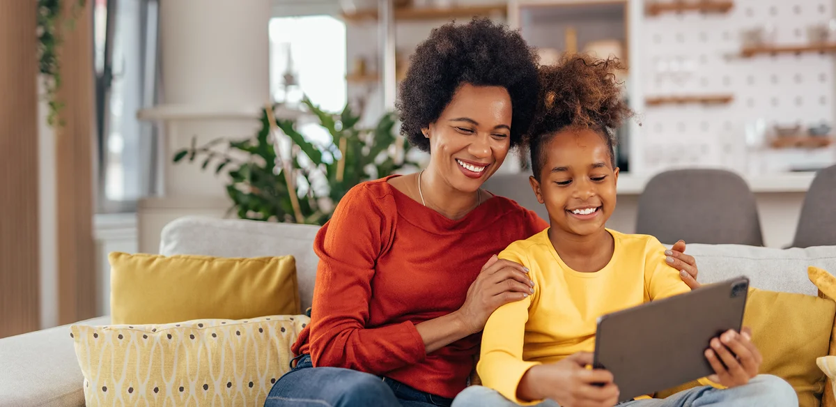 mom and girl smiling